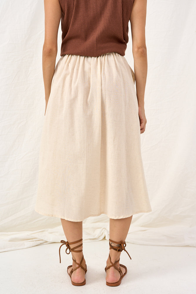 A skirt that is a natural color 